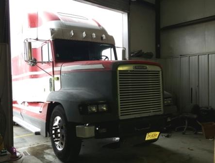 big rig tractor trailer in for paint job