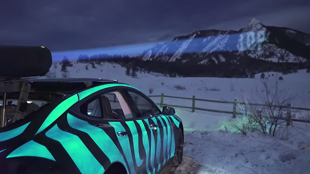 racing extinction car in colorado with electroluminescent paint