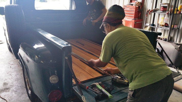 putting wood in truck bed